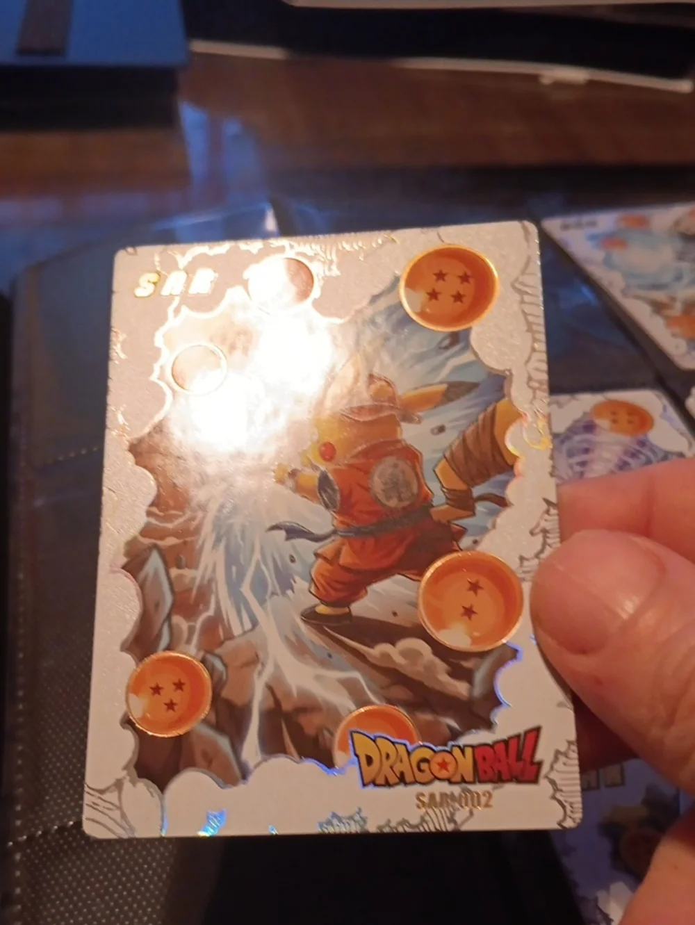 Pokemon Silver Holographic Card with Orange Accents